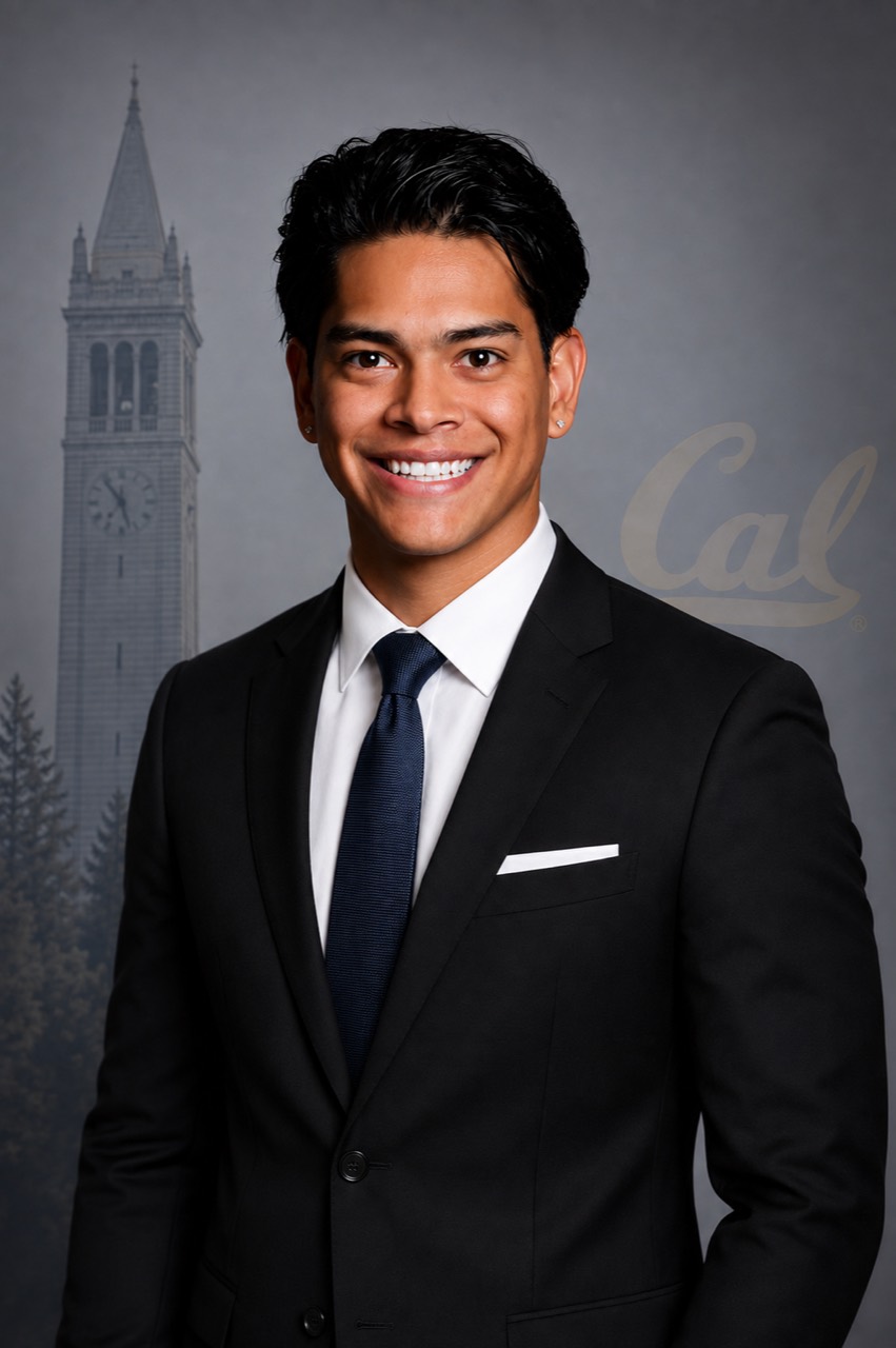 Salvador Bravo in a suit, with UC Berkeley’s Campanile in the background